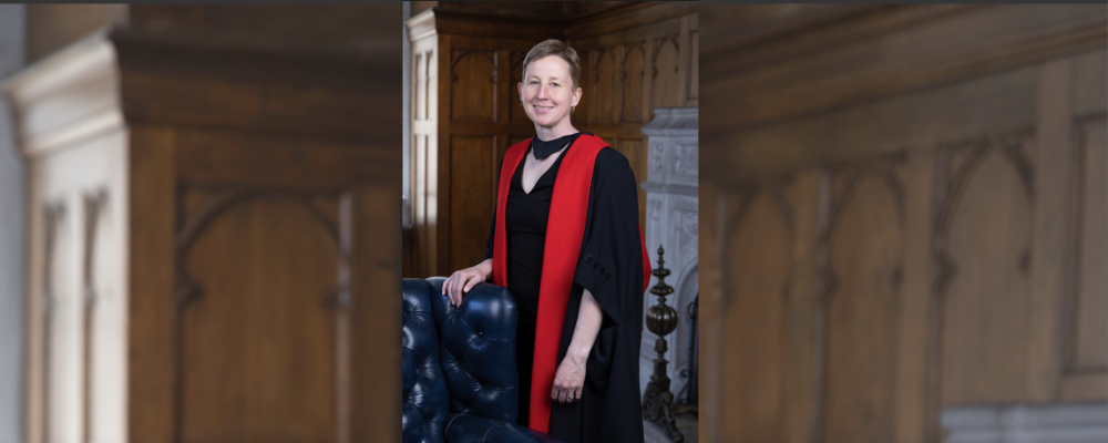 Portrait of Erika Chamberlain in her academic robes from Cambridge